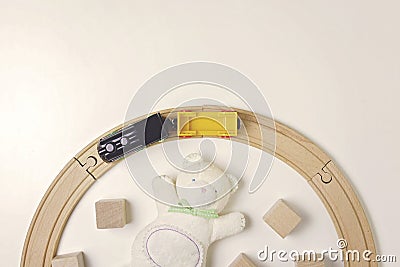 Toys frame with teddy, wooden cubes and toy train on the white background Stock Photo