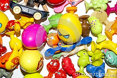 Toys are paper clips, cracked and sticky in the assortment.Toys from the grocery store as a gift. Stock Photo