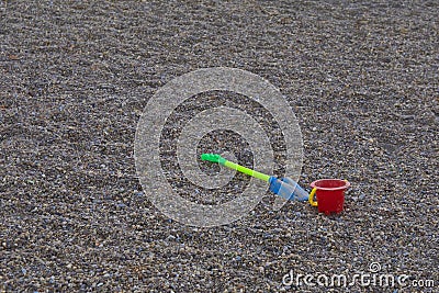 TOYS IN THE PARK lying on the sand Stock Photo