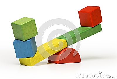 Toys seesaw wooden blocks, teeter totter on white backg Stock Photo