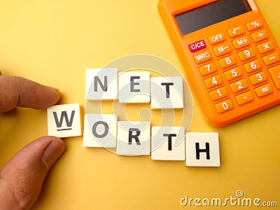 toys word with the word NET WORTH Stock Photo