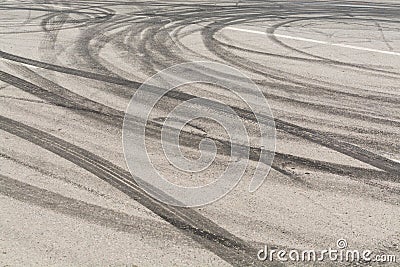 Traces of car tyres on asphalt. Burned rubber traces Stock Photo