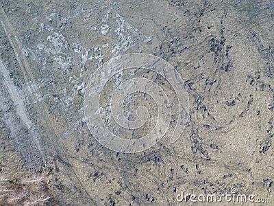 Traces of construction equipment on the soil, aerial view. Lifeless land, wasteland Stock Photo