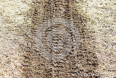 Traces of a heavy car on a wasteland in the spring. Stock Photo