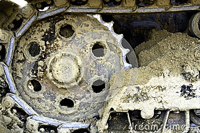 The track and gear wheel of bulldozer on the sand Stock Photo