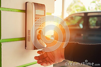 Track Employee Hours Using Biometric Fingerprint Scanner. Stock Photo