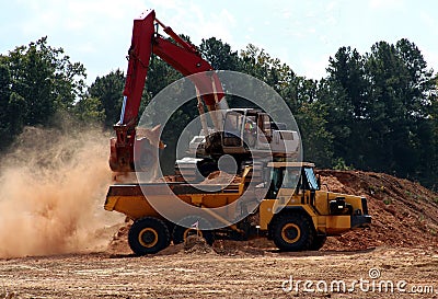 Track Hoe and Dump Truck Stock Photo