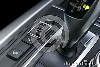 Track and parking sensor control buttons near automatic gear stick of a modern car, car interior details Stock Photo