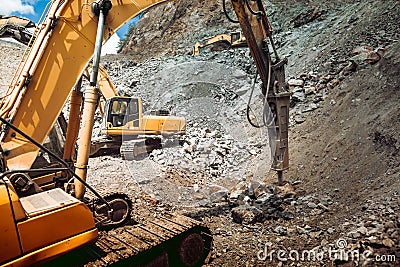 Track type excavator and bulldozer working on construction site. Ore quarry and iron ore quarry Stock Photo