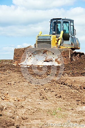 Track-type loader bulldozer excavator at work Stock Photo