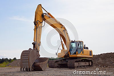 Trackhoe excavator on construction site digger machine heavy equipment Stock Photo