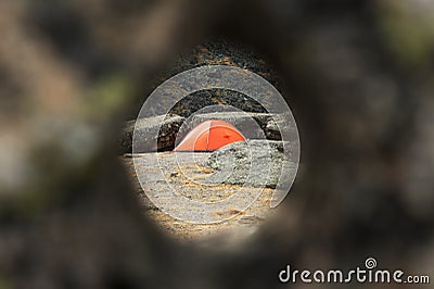 Tracking tent through a round hole in the stone Stock Photo