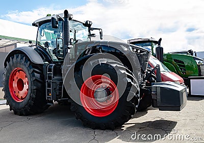 tractor with big wheels, machine for agricultural work and transportation of goods Stock Photo