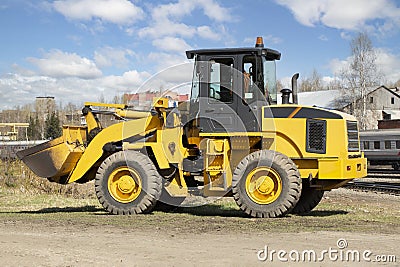 Tractor with bucket.The bulldozer is carrying out repair work.Construction works Stock Photo