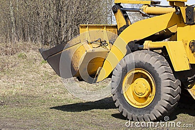 Tractor with bucket.The bulldozer is carrying out repair work.Construction works Stock Photo