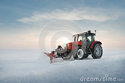 Tractor cleaning snow Stock Photo