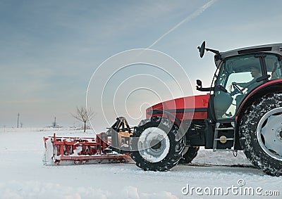 Tractor cleaning snow Stock Photo