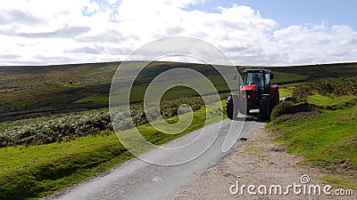 Tractor on a country road Stock Photo
