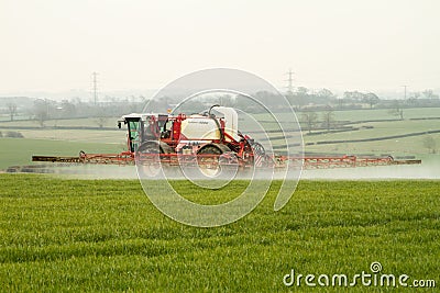 Tractor Crop Spraying in English fields Editorial Stock Photo