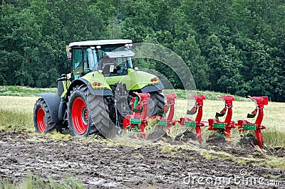 Tractor cultivating Stock Photo