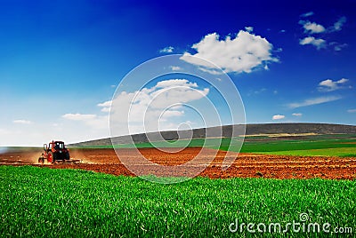 Tractor cultivating 2 Stock Photo