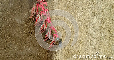 Close up of agricultural machinery plowing agricultural farmland. Stock Photo
