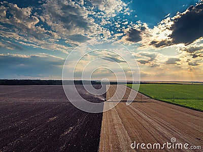 Tractor cultivating field at autumn Stock Photo
