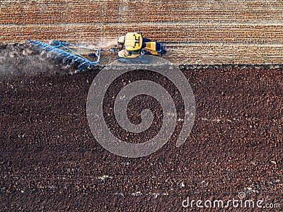 Tractor cultivating field at autumn Stock Photo