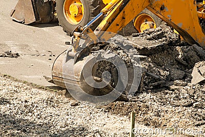 Bulldozer Dismantles Asphalt at Work Stock Photo