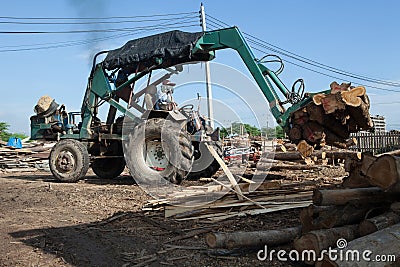 Tractor for export of timber logs Lumber Industry machine with p Stock Photo