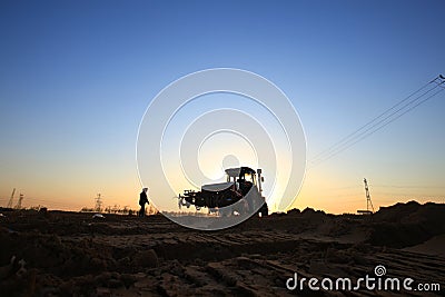 The tractor in farmland farming Editorial Stock Photo