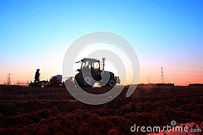 The tractor in farmland farming Stock Photo