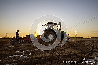 The tractor in farmland farming Stock Photo