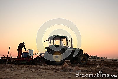 The tractor in farmland farming Editorial Stock Photo