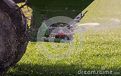 tractor fertilizing in field Stock Photo