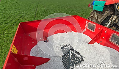 Tractor fertilizing in field Stock Photo