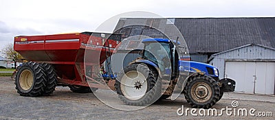 Tractor and grain carts provide larger capacities and performance Editorial Stock Photo