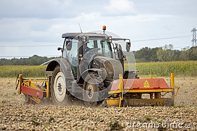 Tractor grubbing onion field Editorial Stock Photo