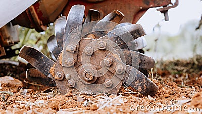 Tractor implement tilling the field Stock Photo