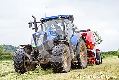 Tractor and lely baler Editorial Stock Photo