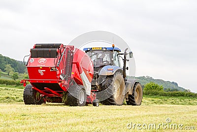 Tractor and lely baler Editorial Stock Photo