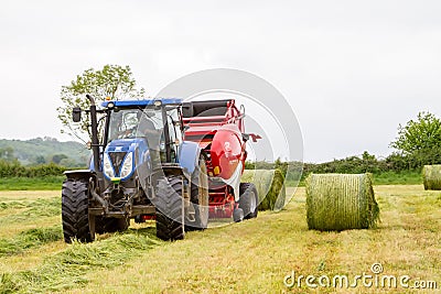 Tractor and lely baler Editorial Stock Photo