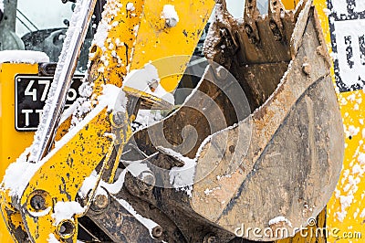 Tractor loader cleans snow after a snowfall Stock Photo