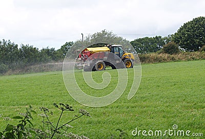 Tractor and Muck Spreader Fertiliser Stock Photo