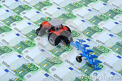 Tractor, plough and Euros Stock Photo