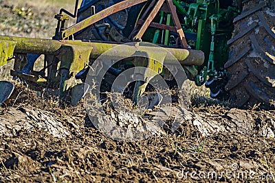 Tractor with plough plow close up Editorial Stock Photo