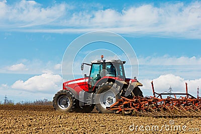 Tractor and Plow Stock Photo