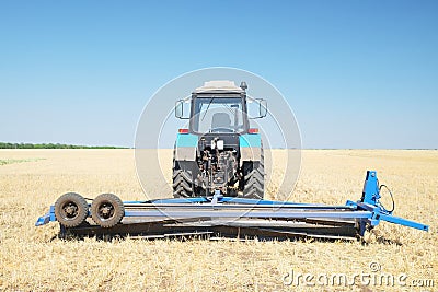 Tractor with a plow Stock Photo