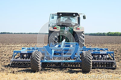 Tractor with a plow Stock Photo