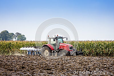 Tractor and plow Stock Photo